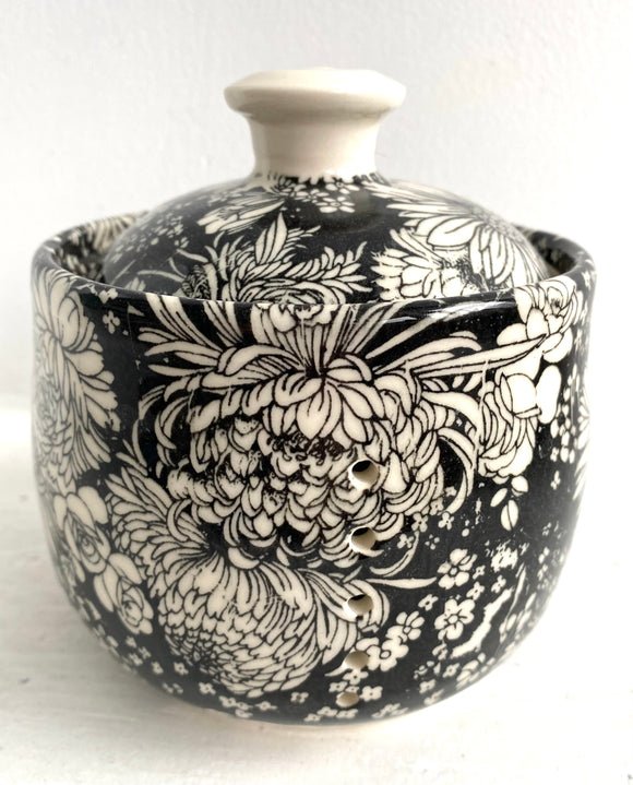 Porcelain Pottery Garlic Keeper with Dahlias on a Black Background