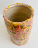 Pottery Vase with Pink flowers on a Yellow Ground