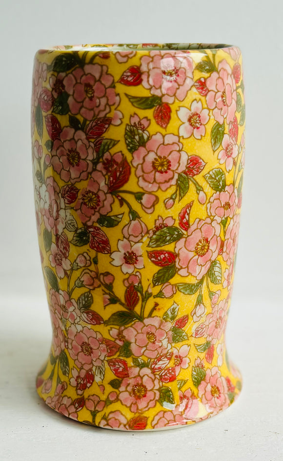 Porcelain Pottery Vase with Pink flowers on a Yellow Ground