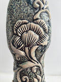 Sculpture: Contemplative Figure with Lotus Flowers