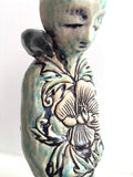 Sculpture: Contemplative Figure with Poppies/Bird