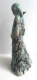 Sculpture: Contemplative Figure with Poppies/Bird