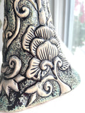 Sculpture: Contemplative Figure with Lotus Flowers