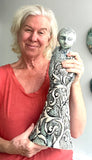 Sculpture: Contemplative Figure with Lotus Flowers