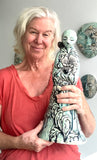 Sculpture: Contemplative Figure with Poppies/Bird