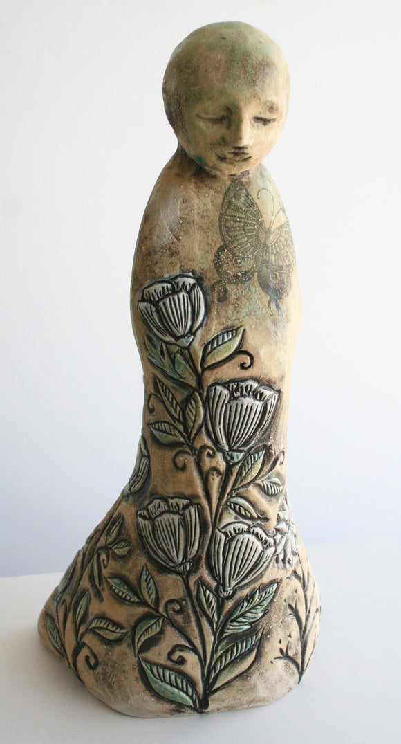 Sculpture: Contemplative Figure with Tulips and Butterfly