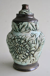 Porcelain Urn with Sunflower Carving